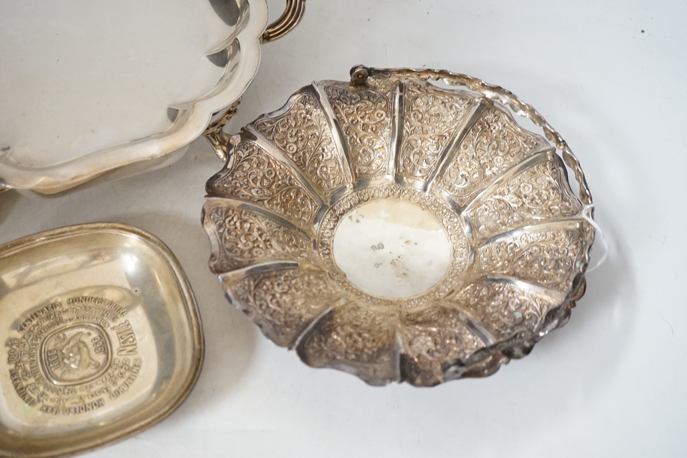 A quantity of assorted 19th century and later plated wares, including two salvers, mounted glass lemonade jug, a warming dish base, pair of wine coasters, rattle Knight's helmet lighter, Christofle and other cutlery, a s